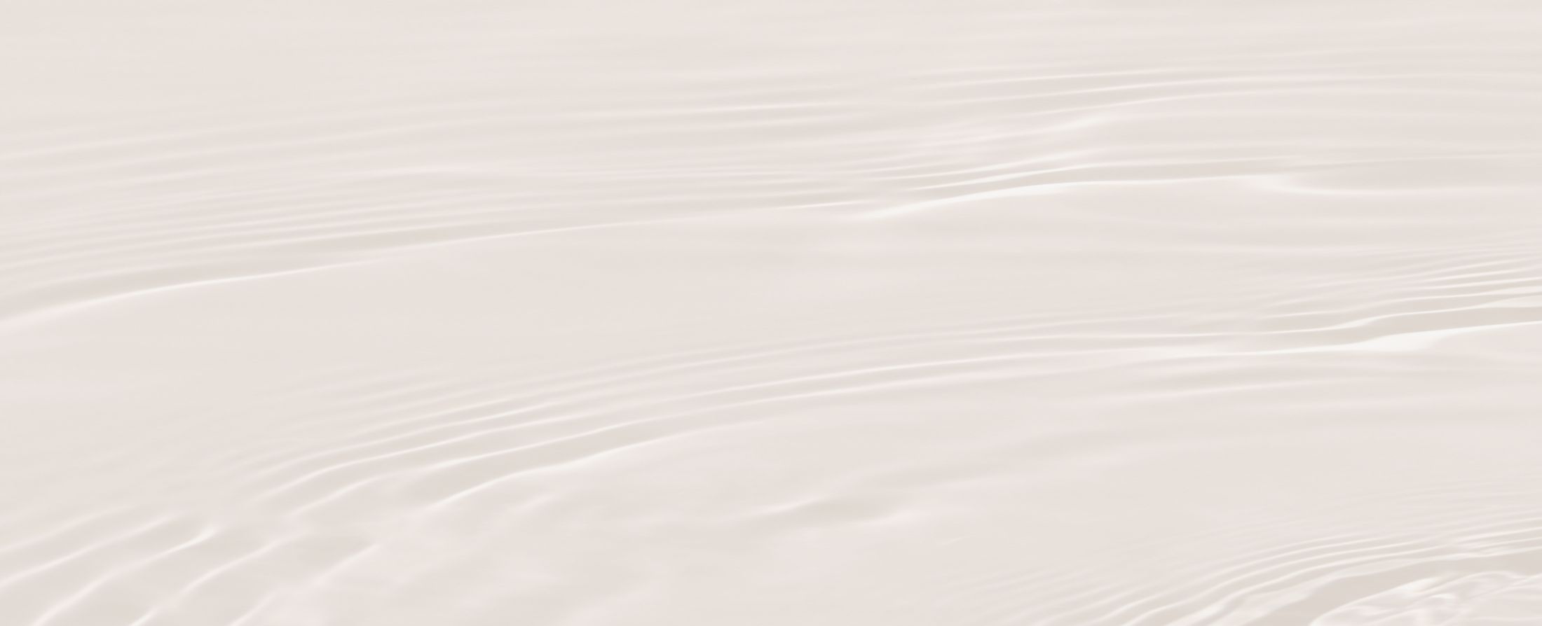 Calm, gentle water surface with subtle ripples.