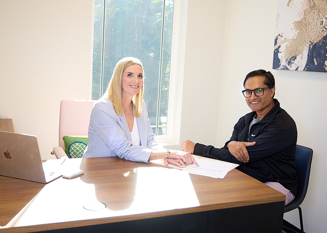 med spa staff consulting with a patient model